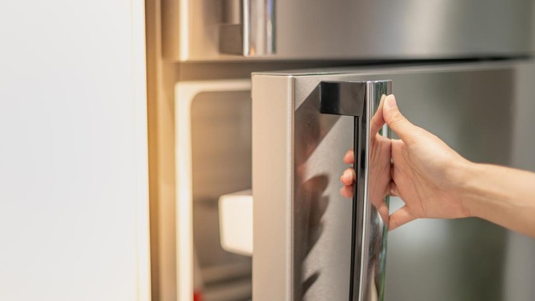 Female hand opening a refrigerator door for find the food and ingredient preparing to cooking in their home&period;