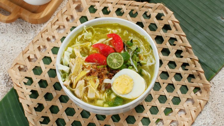 soto ayam&comma; chicken soup with a yellow sauce
