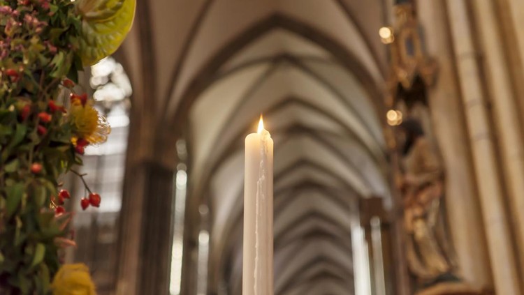 Candle in the Catholic Church&comma; shallow depth of field