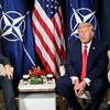 US President Donald Trump (R) speaks with NATO’s Secretary-General Mark Rutte during a bilateral meeting on the sidelines of the World Economic Forum (WEF) annual meeting in Davos on January 21, 2026. The World Economic Forum takes place in Davos f