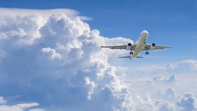 Airplane flying under blue sky and white cloud