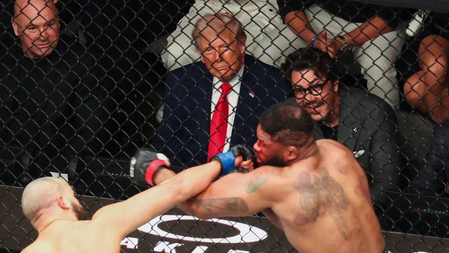 U.S. President Donald Trump and Hunter Campbell, chief business officer of the UFC, watch a match during the UFC 327 event at Kaseya Center in Miami, Florida, U.S., April 11, 2026.  REUTERS/Kevin Lamarque