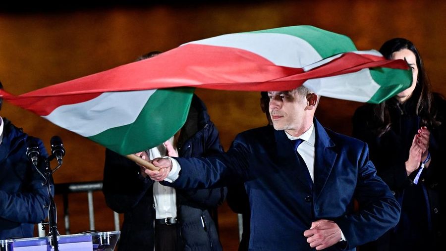 Peter Magyar, leader of the opposition Tisza party, and other officials celebrate following the partial results of the parliamentary election, in Budapest, Hungary, April 12, 2026. REUTERS/Marton Monus     TPX IMAGES OF THE DAY