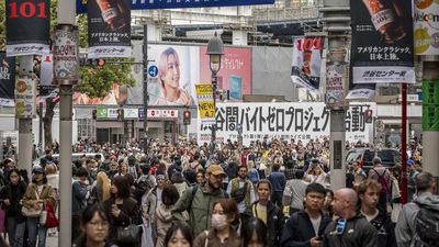 People walk through Shibuya area in Tokyo on April 7, 2026. (Photo by Yuichi YAMAZAKI / AFP)