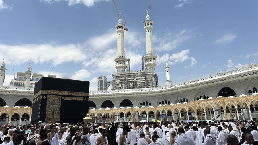 muslim pilgrims wife and husband wearing white traditional clothes for Ihram ready for Hajj