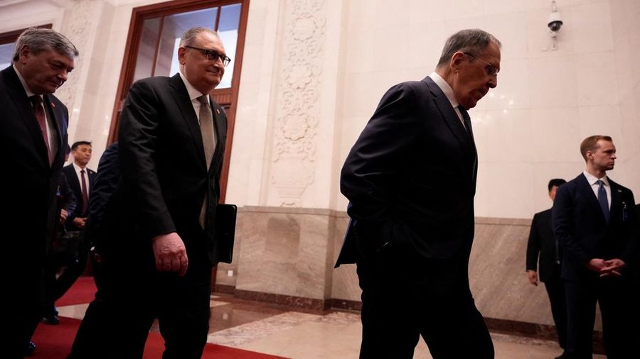 Russia’s Foreign Minister Sergei Lavrov walks for a meeting with China’s President Xi Jinping at the Great Hall of the People in Beijing, China April 15, 2026. Iori Sagisawa/Pool via REUTERS