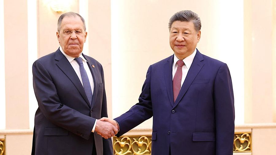 Russia’s Foreign Minister Sergei Lavrov walks for a meeting with China’s President Xi Jinping at the Great Hall of the People in Beijing, China April 15, 2026. Iori Sagisawa/Pool via REUTERS