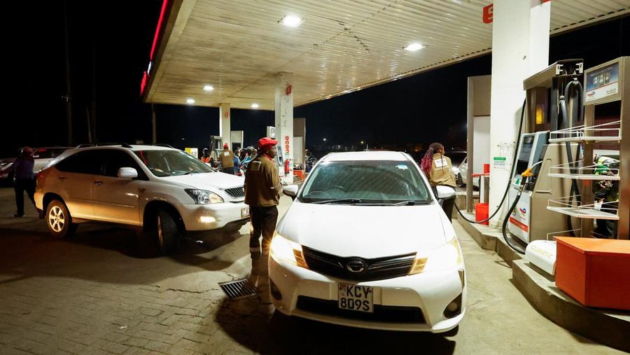 A fuel pump attendant confirms a mobile phone payment as he fuels a motorcycle taxi at a TotalEnergies petrol station ahead of an announced fuel price hike, as fuel costs rise amid dunia disruptions caused by the Iran war, in Nairobi, Kenya April 14, 2026. REUTERS/Thomas Mukoya