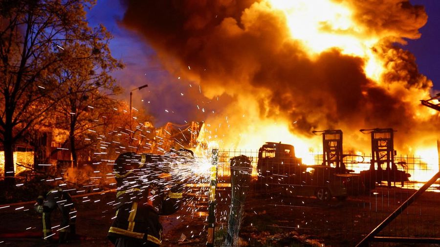 Firefighters work at the site of a recyclable materials warehouse hit by a Russian missile strike, amid Russia's attack on Ukraine, in Kyiv, Ukraine April 16, 2026. REUTERS/Valentyn Ogirenko