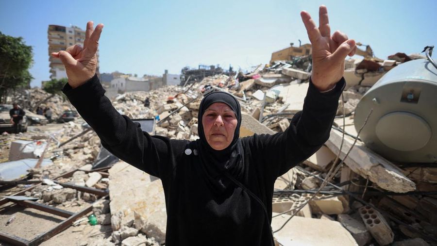 People gather at the site of an Israeli strike carried out before a 10-day ceasefire between Lebanon and Israel went into effect, in Tyre, Lebanon, April 17, 2026. REUTERS/Louisa Gouliamaki