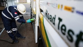 A worker refuels the truck with biodiesel 50% during a B50 testing event, as Indonesia plans to raise the mandatory blending rate for palm-based biodiesel from 40% to 50%, a standard known as B50, that is part of the government's wider plan to mitiga