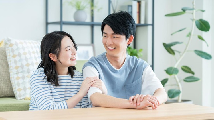 A young couple relaxing in the living room