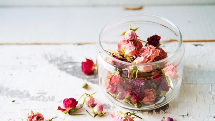 dried rose petals in a glass jar