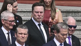 US Secretary of Defense Pete Hegseth (bottom C), US Treasury Secretary Scott Bessent (centre R), Nvidia founder and CEO Jensen Huang (R), Tesla and SpaceX CEO Elon Musk (centre R middle row) and Apple CEO Tim Cook (centre L middle row) look on ahead