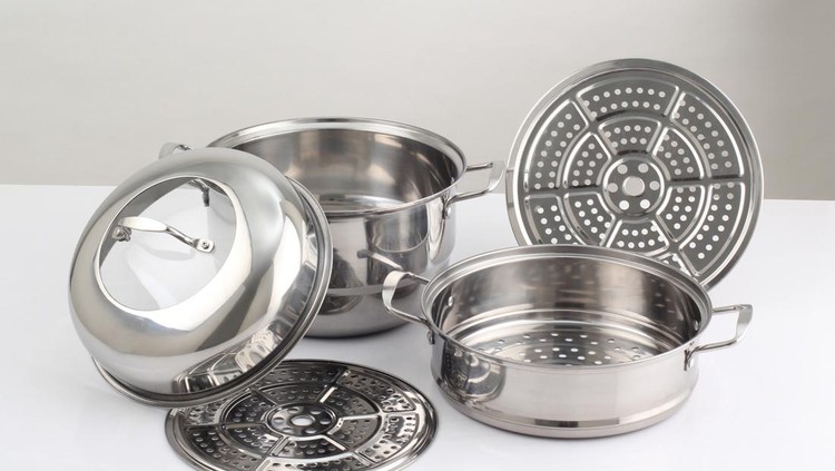 set of stainless steel pots isolated on white background