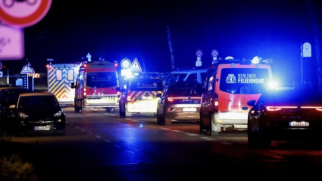 A convoy with an ambulance believed to be carrying an American health worker, who has been brought to Germany for treatment after contracting Ebola in the Democratic Republic of Congo, arrives at the Charite University Hospital in Berlin, Germany, Ma