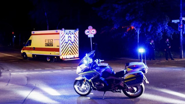 A convoy with an ambulance believed to be carrying an American health worker, who has been brought to Germany for treatment after contracting Ebola in the Democratic Republic of Congo, arrives at the Charite University Hospital in Berlin, Germany, Ma