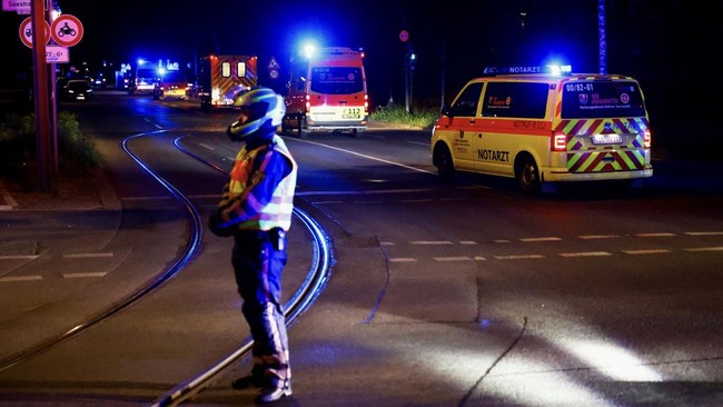 A convoy with an ambulance believed to be carrying an American health worker, who has been brought to Germany for treatment after contracting Ebola in the Democratic Republic of Congo, arrives at the Charite University Hospital in Berlin, Germany, Ma