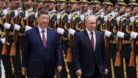 Russian President Vladimir Putin and Chinese President Xi Jinping inspect an honor guard during a welcoming ceremony at the Great Hall of the People in Beijing, China May 20, 2026. REUTERS/Maxim Shemetov/Pool     TPX IMAGES OF THE DAY