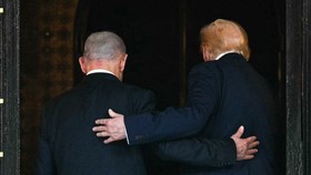 US President Donald Trump (R) and Israeli Prime Minister Benjamin Netanyahu shake hands as they arrive to speak to journalists during a joint press conference at Trumps Mar-a-Lago residence in Palm Beach, Florida, on December 29, 2025. US President D
