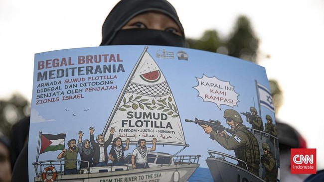 Aliansi kemanusiaan gelar aksi solidaritas untuk Palestina di depan Kedubes AS, Jakarta, Jumat (22/5/2026). (CNNIndonesia/Adi ibrahim)