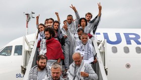 Activists from the Gaza-bound Global Sumud Flotilla, detained by Israeli forces after their vessels were intercepted in international waters in the Mediterranean, disembark a plane upon arrival at Istanbul Airport, Turkey, May 21, 2026. REUTERS/Murad