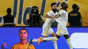 Nassr's Senegalese Forward #10 Sadio Mane (R) celebrates with his teammate Saudi defender #12 Nawaf Boushal after scoring his team's first goal during the Saudi Pro League football match between Al-Nassr and Damac at the Al-Awwal Park Stadium in Riya