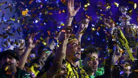 Nassr's Portuguese forward #07 Cristiano Ronaldo (C) along with teammates celebrate with the trophy after winning the Saudi Pro League title at the end of their football match against Damac at the Al-Awwal Park Stadium in Riyadh on May 21, 2026. (Pho