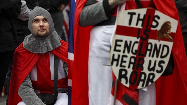 A protester wearing a costume takes part in a