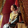 This handout picture taken and released by Thai Royal Household Bureau on December 12, 2019 shows Thailand's King Maha Vajiralongkorn's daughter Princess Bajrakitiyabha sits in her barge during the Royal Barge procession in Bangkok. The Royal barge p
