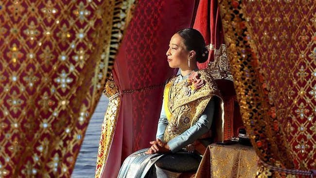 This handout picture taken and released by Thai Royal Household Bureau on December 12, 2019 shows Thailand's King Maha Vajiralongkorn's daughter Princess Bajrakitiyabha sits in her barge during the Royal Barge procession in Bangkok. The Royal barge p