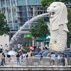 People visit the Merlion statue on the Marina Bay waterfront in Singapore on May 5, 2026. (Photo by Roslan RAHMAN / AFP)