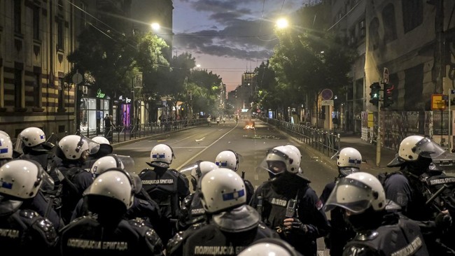 Riot police chase demonstrators during sporadic clashes that erupt at the end of an anti-government protest decrying corruption and calling for early elections following the collapse of a railway station canopy in Novi Sad that killed 16 in November
