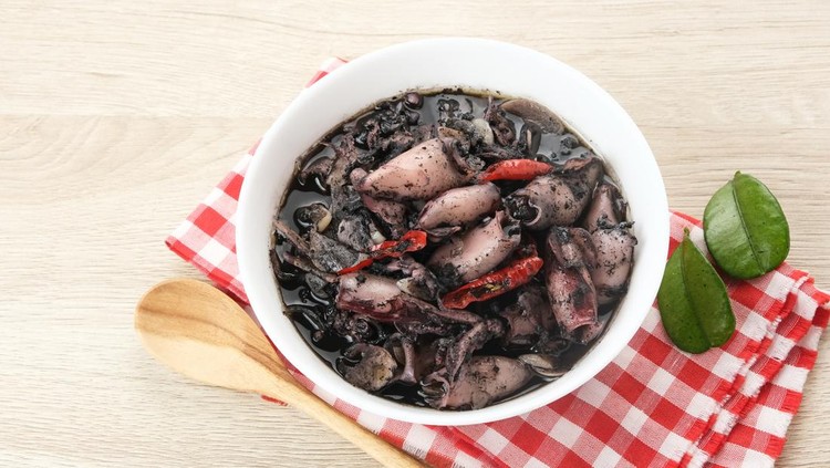Squid Black Soup &lpar;Tumis Cumi Hitam&rpar; or stir-fried squid in black ink&comma; Indonesian traditional food