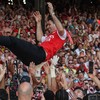 Arsenal's Spanish manager Mikel Arteta is thrown into the air by his players as they all celebrate after the Premier League trophy presentation ceremony on the pitch after the English Premier League football match between Crystal Palace and Arsenal a