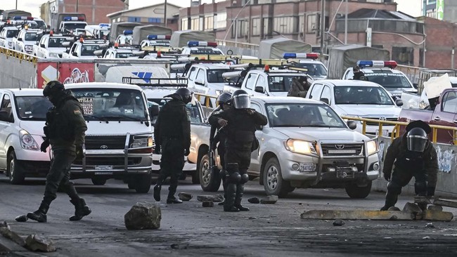 Security personnel and other workers try to open