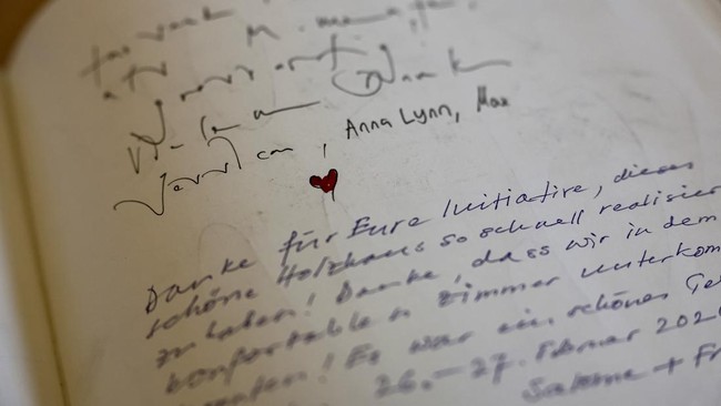 A detail of the guest book of the newly built Momentum Lodge, at the Lauchernalp in Wiler, nearly a year after a massive rock and ice slide triggered by the collapse of the Birch Glacier destroyed much of the village of Blatten, Switzerland, May 20,