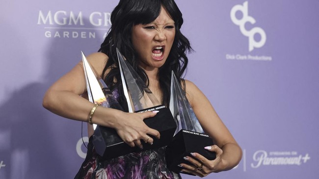 South Korean-US singer songwriter Rei Ami of Huntrix, poses in the press room with the Song of the Year, Best Pop Song and Best Vocal Performance awards for