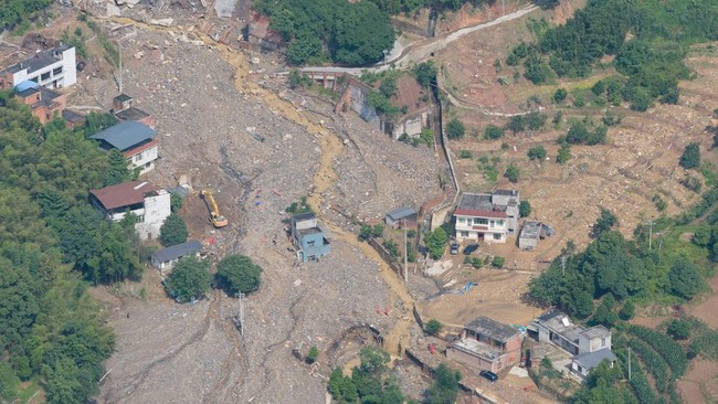 A drone view of rescue operations underway in Anxi village following flash floods and landslides triggered by extreme rainfall, in Yongchuan district, Chongqing, China May 24, 2026. cnsphoto via REUTERS ATTENTION EDITORS - THIS IMAGE WAS PROVIDED BY
