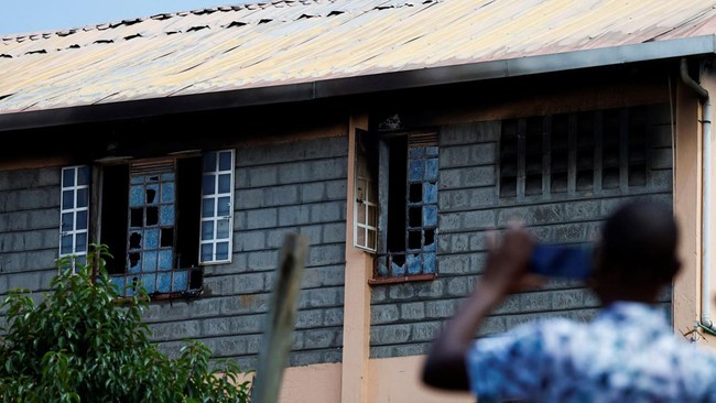 Parents take photographs of the ruins of the dormitory following an overnight fire at the Utumishi Girls' Academy Senior School in Gilgil, Nakuru county, Kenya May 28, 2026. REUTERS/Thomas Mukoya     TPX IMAGES OF THE DAY