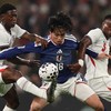 Japan's forward Ayase Ueda (C) vies with England's midfielder Kobbie Mainoo (L) and England's defender Marc Guehi (R) during the friendly international football match between England and Japan at Wembley Stadium in London on March 31, 2026. (Photo by