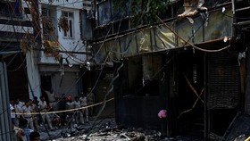 Firefighters and police officers work at the site after a fire at a hotel in New Delhi, India, June 3, 2026. REUTERS/Adnan Abidi
