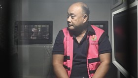 Tersangka dugaan tindak pidana korupsi tata kelola program Makan Bergizi Gratis (MBG) pada Badan Gizi Nasional (BGN) Dadan Hindayana berada di dalam mobil tahanan di Kejaksaan Agung, Jakarta, Rabu (3/6/2026). Kejaksaan Agung menetapkan mantan Kepala