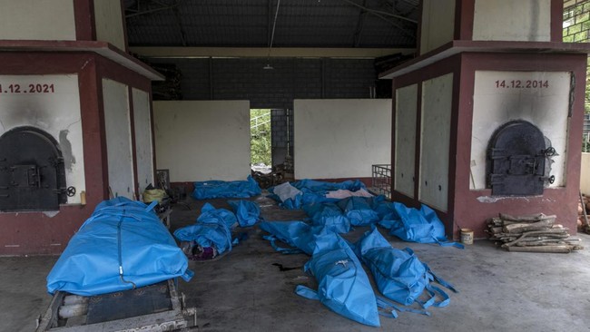 The bodies of blast victims are arranged on the floor at a crematorium following an explosion in Kaung Tat village, in Namhkam Township in Myanmar's Shan state on June 1, 2026. A blast in northern Myanmar killed dozens of people on May 31, two rescue