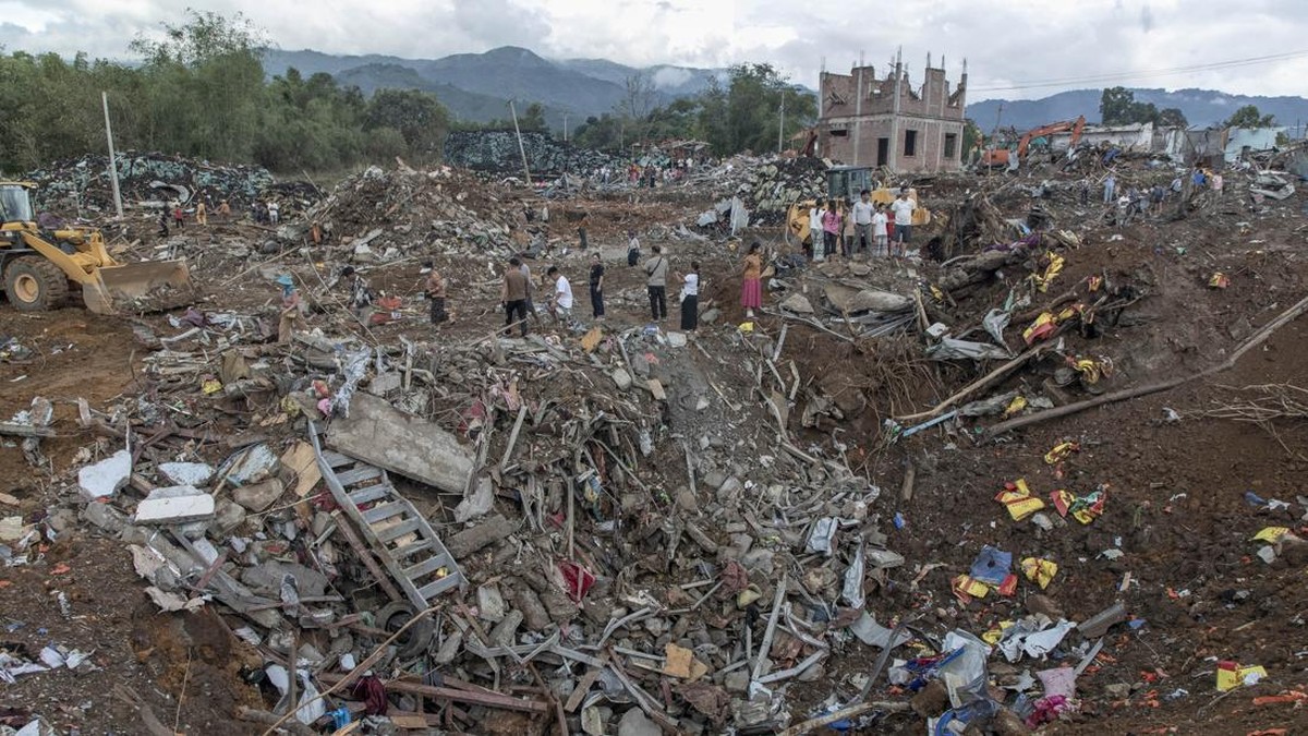 Rescuers and local residents carry out search operations in the aftermath of an explosion in Kaung Tat village, in Namhkam Township in Myanmar's Shan state on June 1, 2026. A blast in northern Myanmar killed dozens of people on May 31, two rescue wor