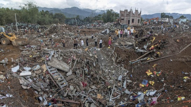 Rescuers and local residents carry out search operations in the aftermath of an explosion in Kaung Tat village, in Namhkam Township in Myanmar's Shan state on June 1, 2026. A blast in northern Myanmar killed dozens of people on May 31, two rescue wor