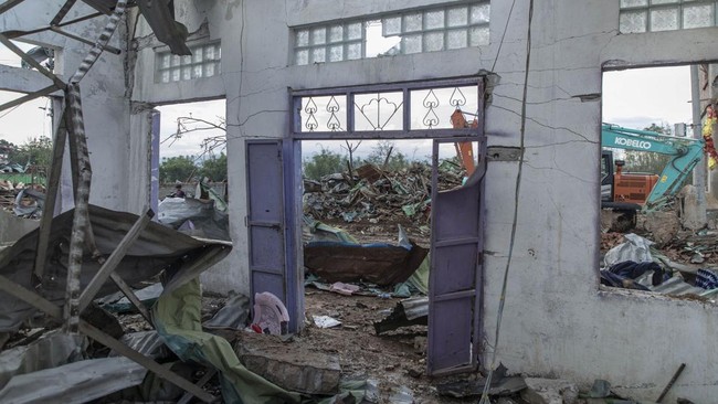 A general view shows debris amongst buildings destroyed in an explosion in Kaung Tat village, in Namhkam Township in Myanmar's Shan state on June 1, 2026. A blast in northern Myanmar killed dozens of people on May 31, two rescue workers said, with re