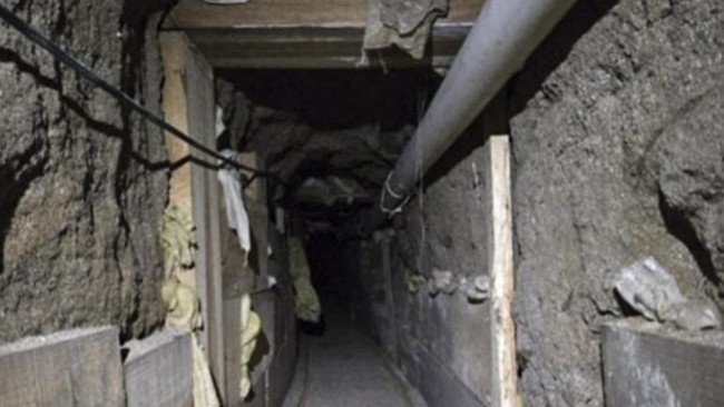 This undated handout photo released by the US Department of Justice on June 1, 2026, shows a US-Mexico cross-border tunnel, stretching from Tijuana, Mexico to a purported retail store near the Otay Mesa Port of Entry in California. A sophisticated tu