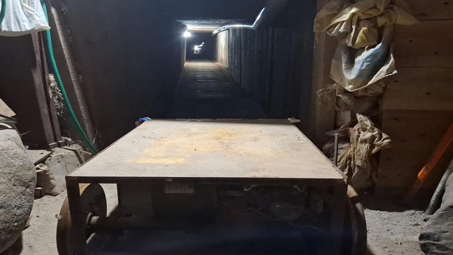 This handout picture released by Mexico's Secretariat of Security and Citizen Protection on June 1, 2026, shows the entrance to an underground tunnel connecting Mexico and the United States discovered by the Criminal Investigation Agency (AIC) in Tij