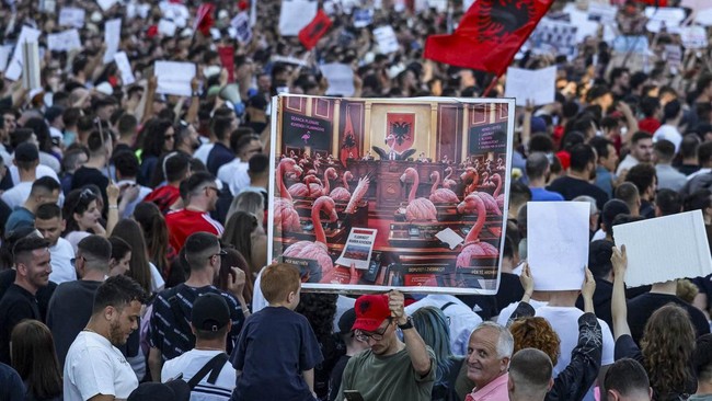 Protesters hold banners during a protest against a luxury resort development planned by a company linked with Donald Trump's son-in-law, Jared Kushner, on an environmentally sensitive part of the Adriatic coast, in Tirana, Albania, June 4, 2026. REUT